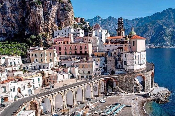 Atrani's white houses stacked behind the arched viaduct that carries the coast road over the village