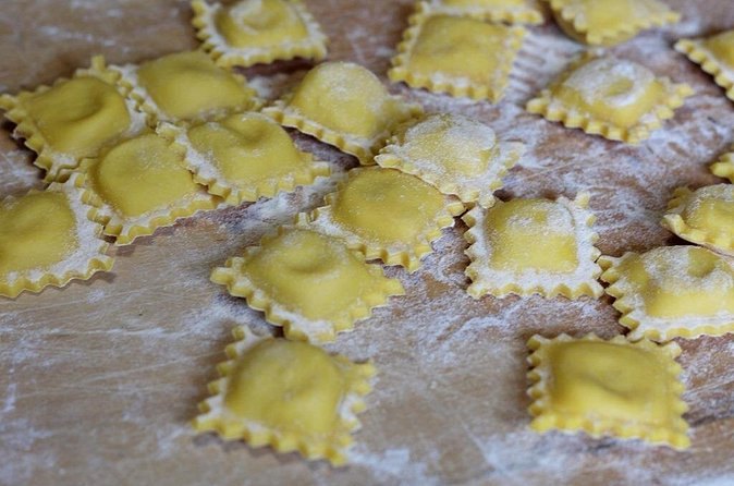 Hand-made ravioli laid out on a floured board in a Positano kitchen