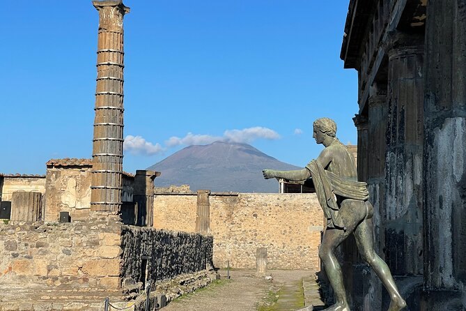The ruins of Pompeii with Mount Vesuvius on the skyline behind them
