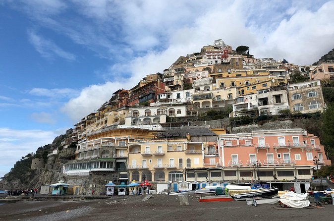 The tiers of Positano rising straight off the beach, balconies stepped one above another
