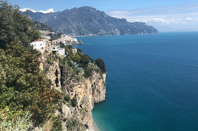 A white house standing on the cliff edge high above the Tyrrhenian Sea